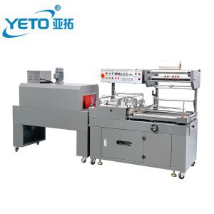 L Escriba la caja de papel pequeña y las botellas de equipo que reduce la máquina de embalaje.